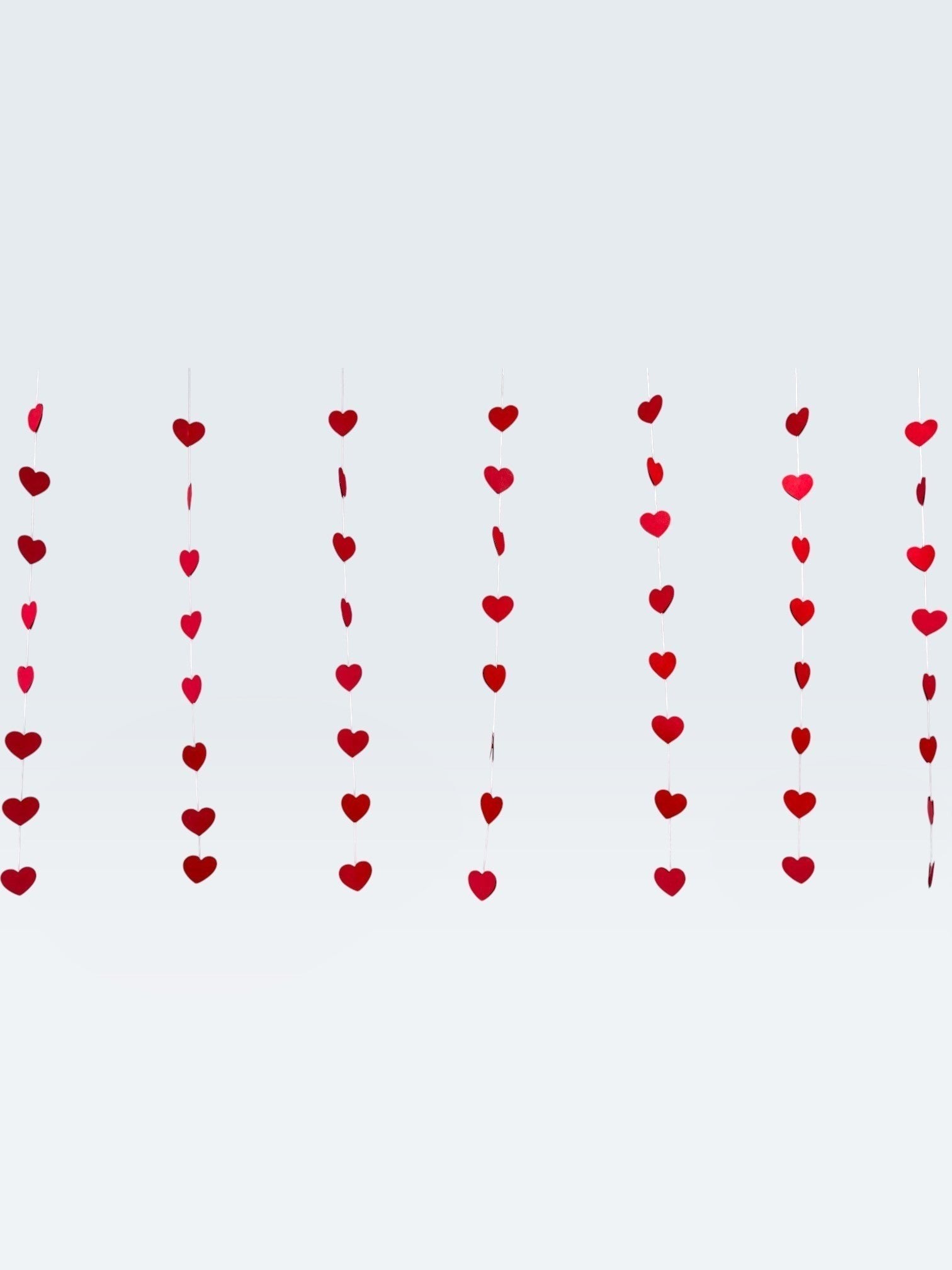 Paper Party Studio red heart garland set of 10 hanging paper streamers for romantic wedding or Valentine's decor.