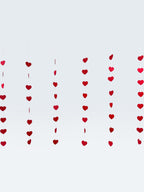 Paper Party Studio red heart garland, set of 10 strings with mini heart cut-outs, perfect for Valentine's Day or weddings.