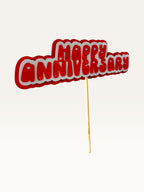 Paper Party Studio handmade red and white layered paper Happy Anniversary cake topper with heart cut-out details.