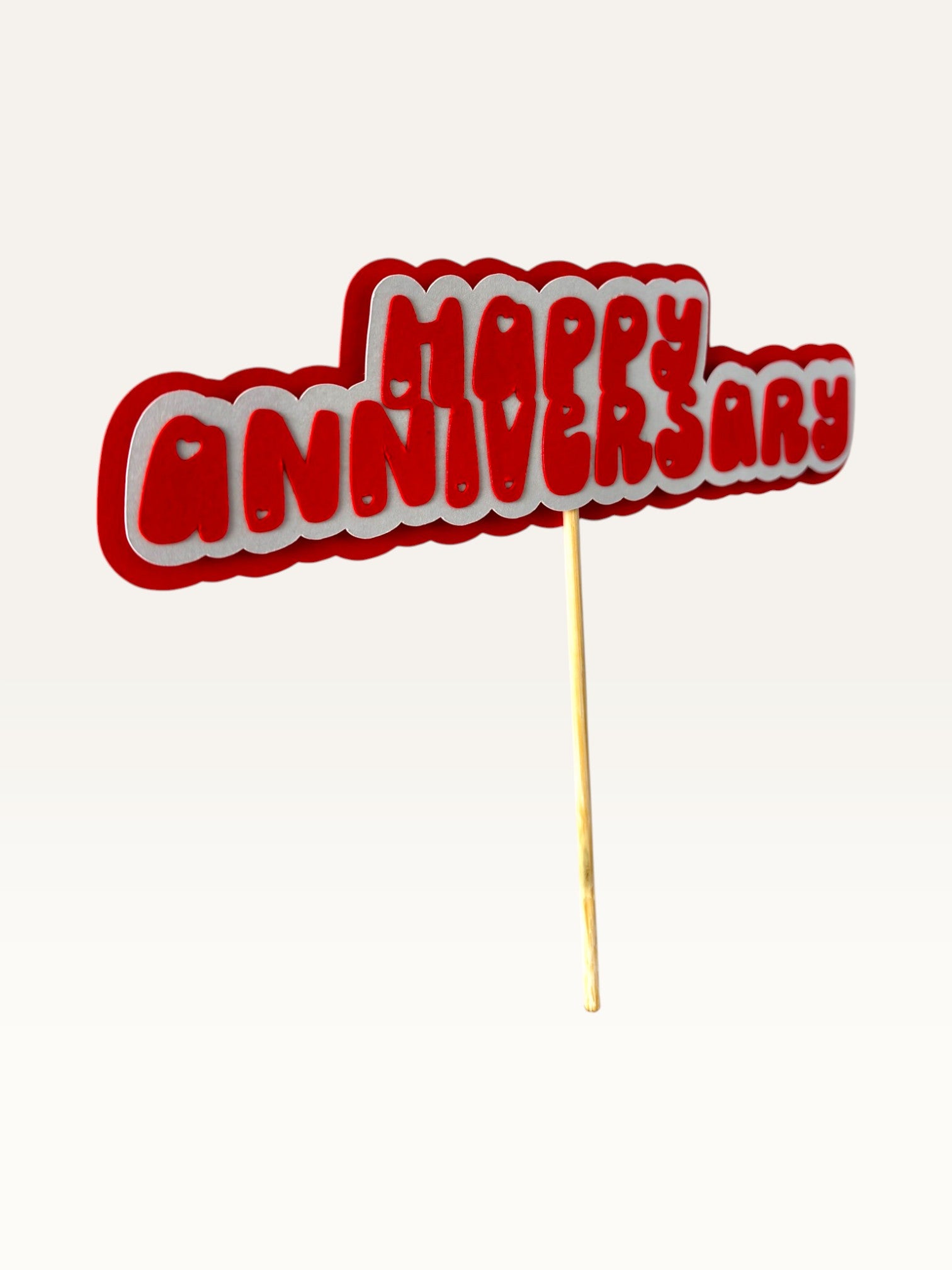 Paper Party Studio handmade red and white layered paper Happy Anniversary cake topper with heart cut-out details.