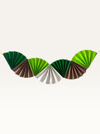 Paper Party Studio jungle safari themed paper fan garland in shades of green, brown, and cream for birthday decor.
