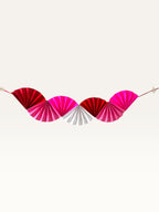 Paper Party Studio Valentine's scallop garland in shades of red, pink, and white for romantic party decor.