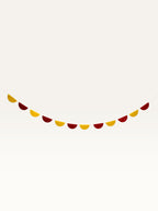 Paper Party Studio yellow and red paper scallop string garland for Diwali and pooja room decoration