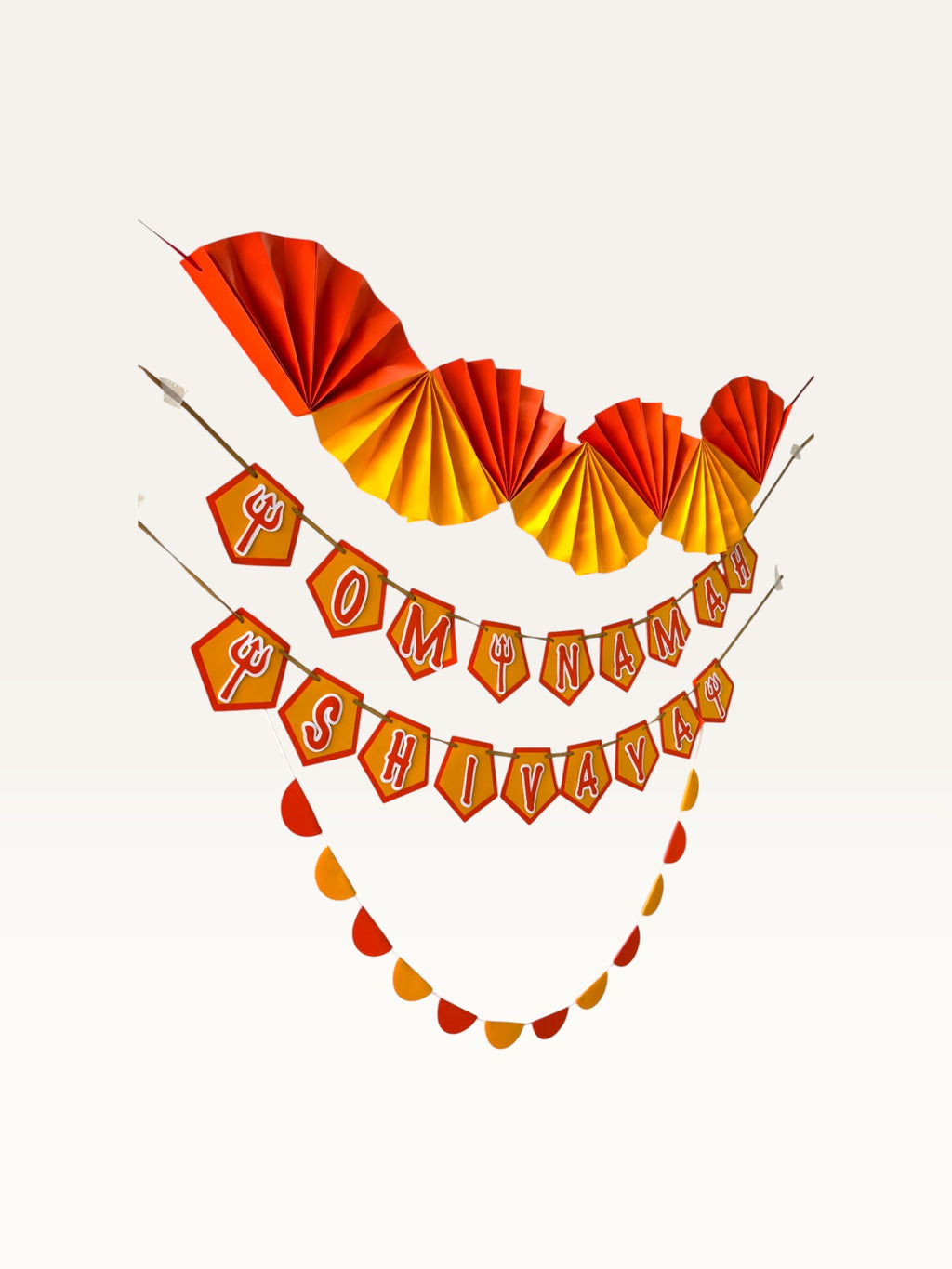 Paper Party Studio Om Namah Shivaya devotional paper decoration set in saffron, orange, and yellow for mandir decor.