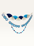Paper Party Studio Om Namah Shivaya paper decoration set with navy, blue, and cream fan and scalloped garlands.