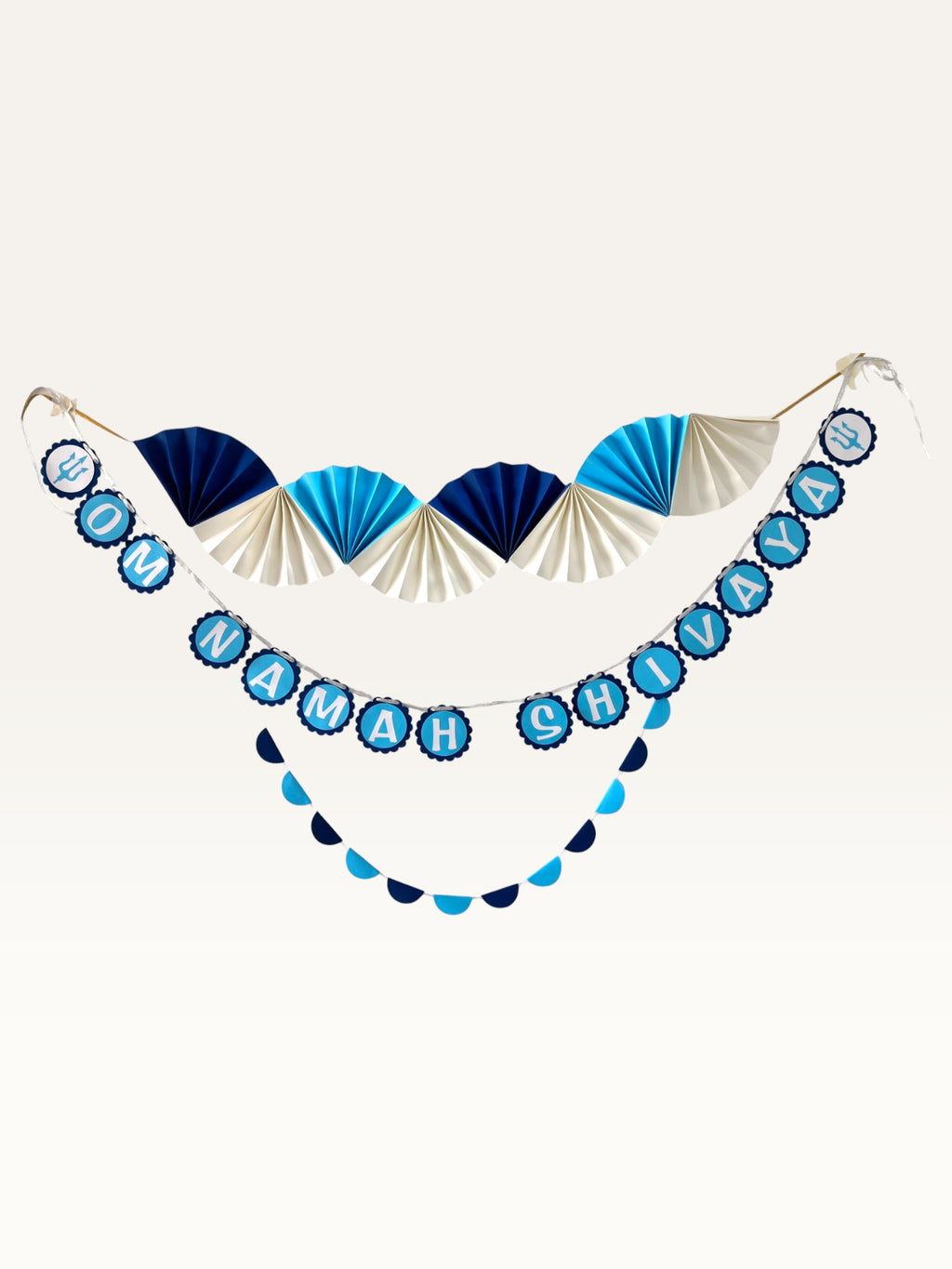 Paper Party Studio Om Namah Shivaya paper pooja decoration set in navy, blue, and cream with fans and trishul motifs.