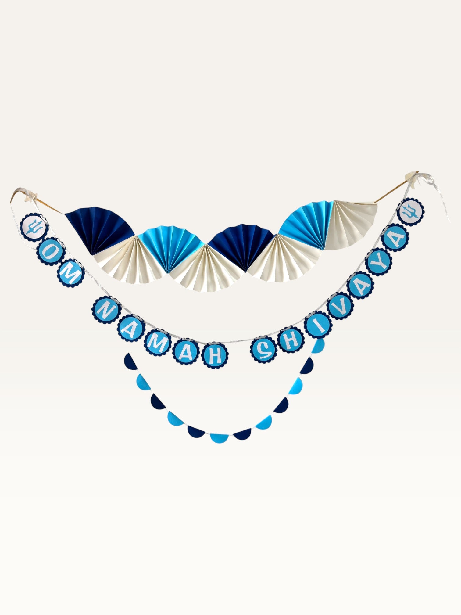 Paper Party Studio Om Namah Shivaya paper pooja decoration set in navy, blue, and cream with fans and trishul motifs.