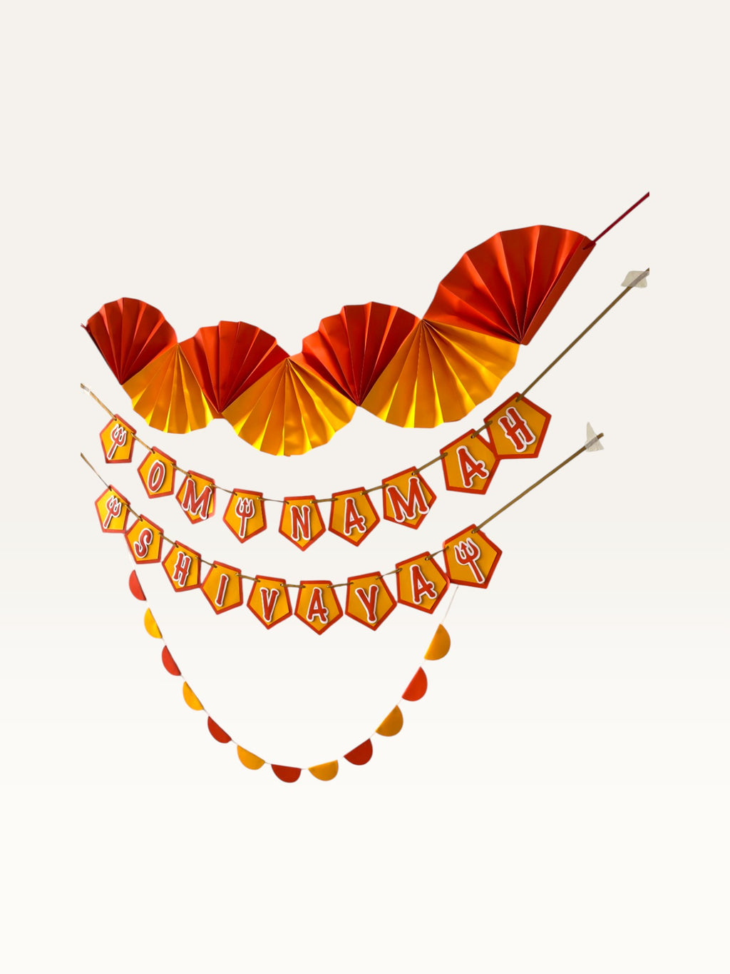 Paper Party Studio Om Namah Shivaya devotional paper decoration set in saffron, orange, and yellow with trishul motifs.