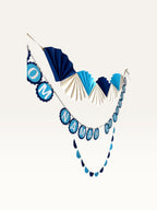 Paper Party Studio Om Namah Shivaya devotional paper garland set in navy, blue, and cream for mandir decoration.