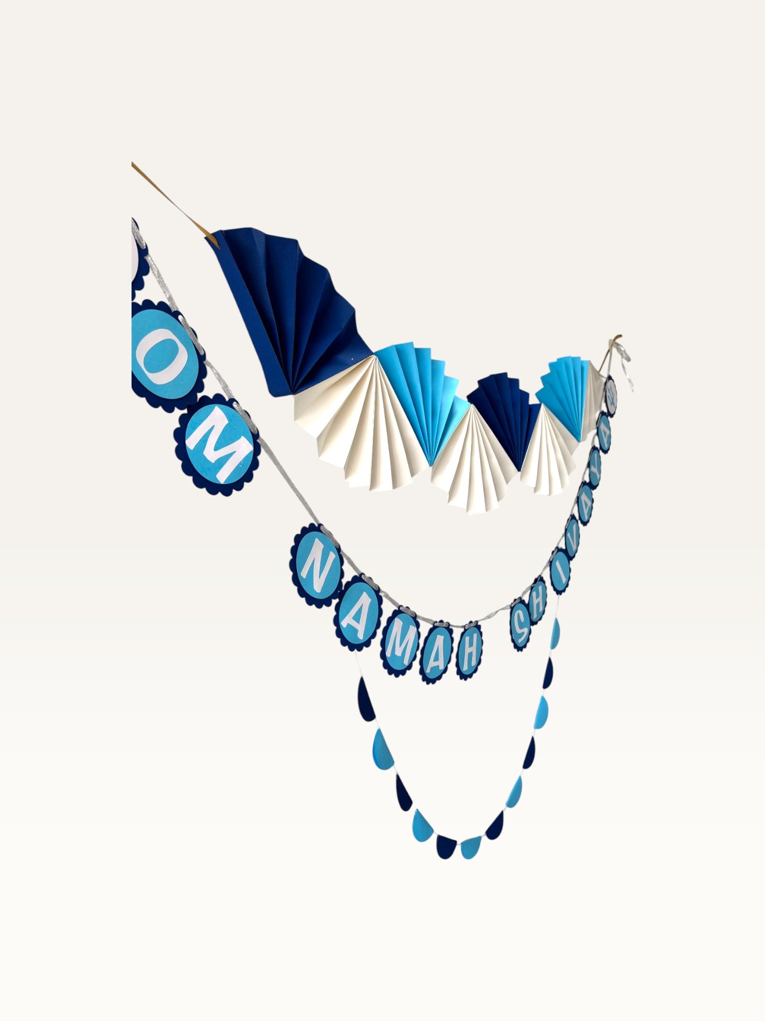 Paper Party Studio Om Namah Shivaya devotional paper garland set in navy, blue, and cream for mandir decoration.