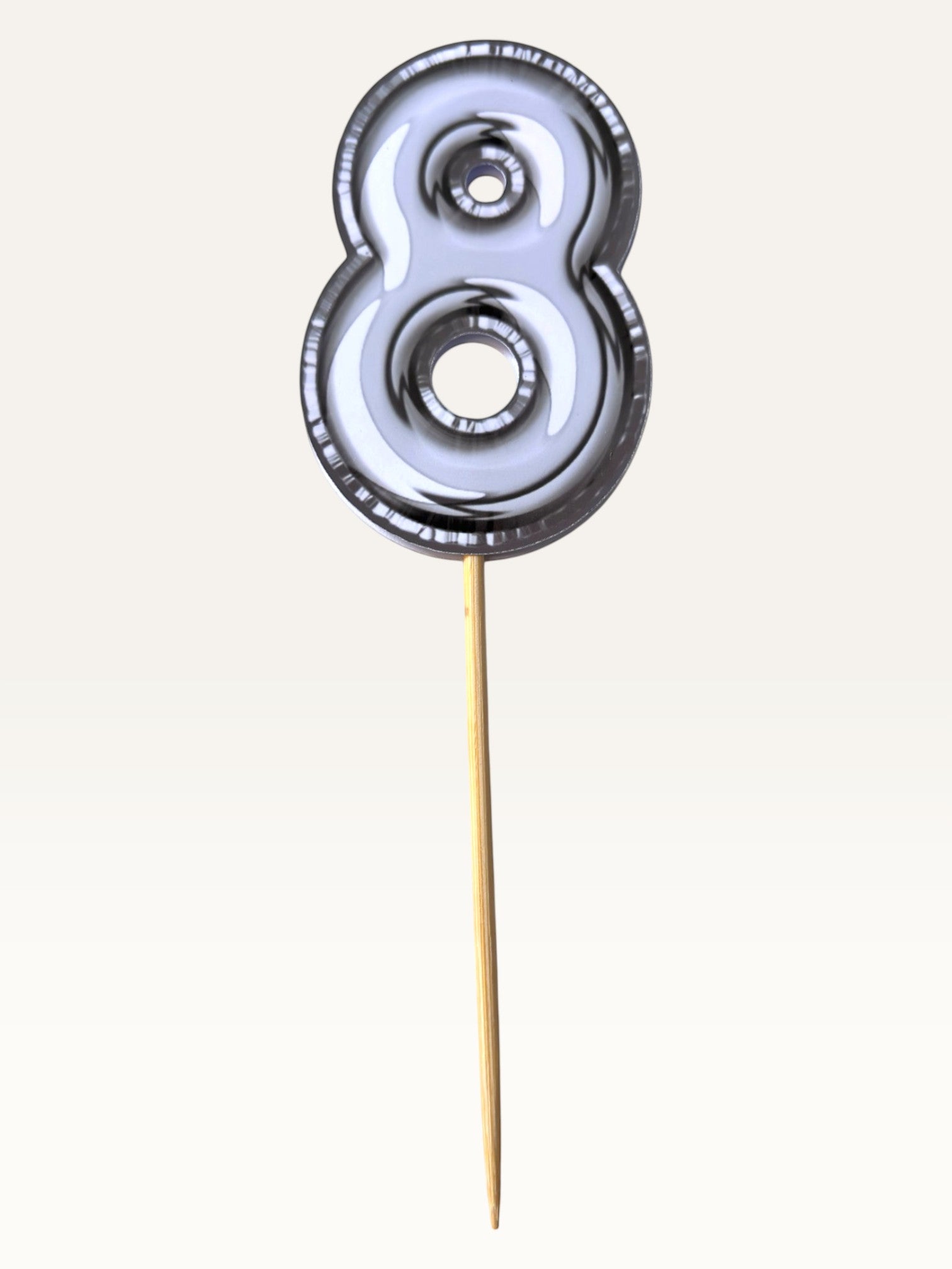 Paper Party Studio silver foil number eight cupcake topper on a bamboo stick with a double-sided metallic finish.