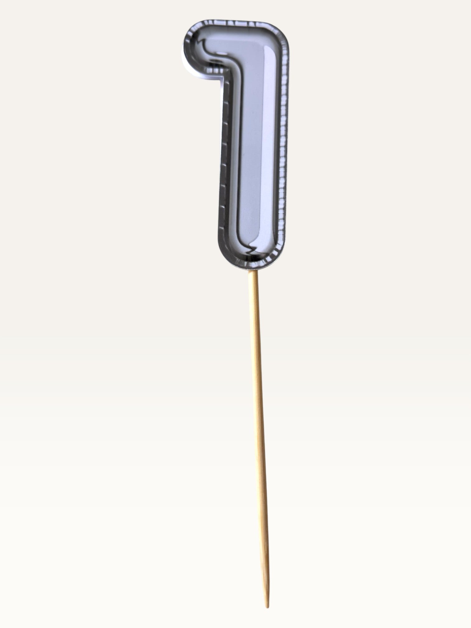 Paper Party Studio silver foil number one cupcake topper on a bamboo stick with double-sided print