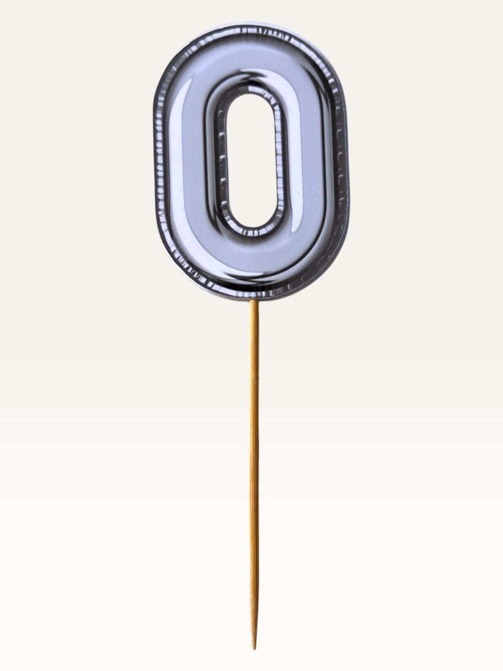 Paper Party Studio silver foil number zero cake topper with a sleek chrome finish on a bamboo stick