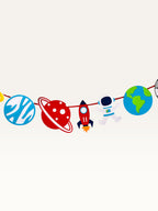 Paper Party Studio space adventure garland featuring colorful paper astronauts, rockets, and planets on a red cord.