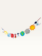 Paper Party Studio space adventure garland featuring paper astronauts, rockets, planets, and sun on a hanging cord.