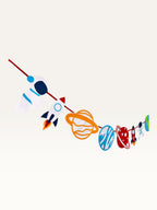 Paper Party Studio space adventure garland featuring colorful paper astronauts, rockets, and planets on a hanging cord.