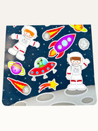 Paper Party Studio space explorer sticker sheet featuring astronauts, rockets, and planets on a starry blue background.