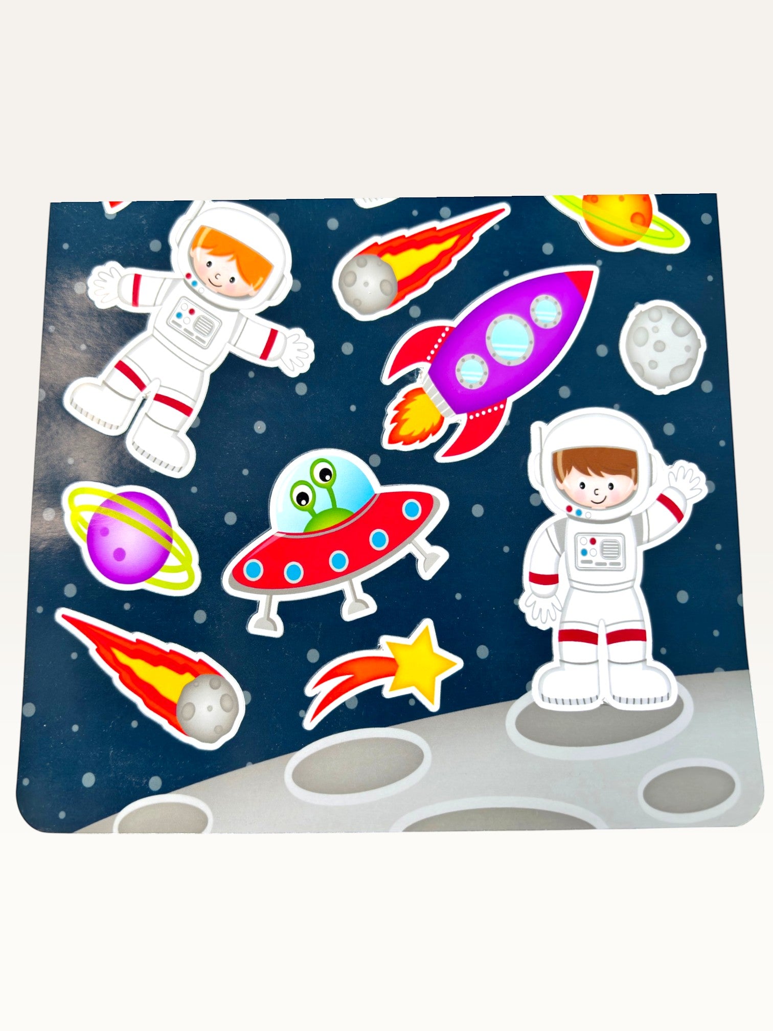 Paper Party Studio space explorer sticker sheet featuring astronauts, rockets, and planets on a starry blue background.