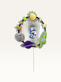 Paper Party Studio personalised space-themed number cake topper with a silver foil ring, rocket, moon, and stars.
