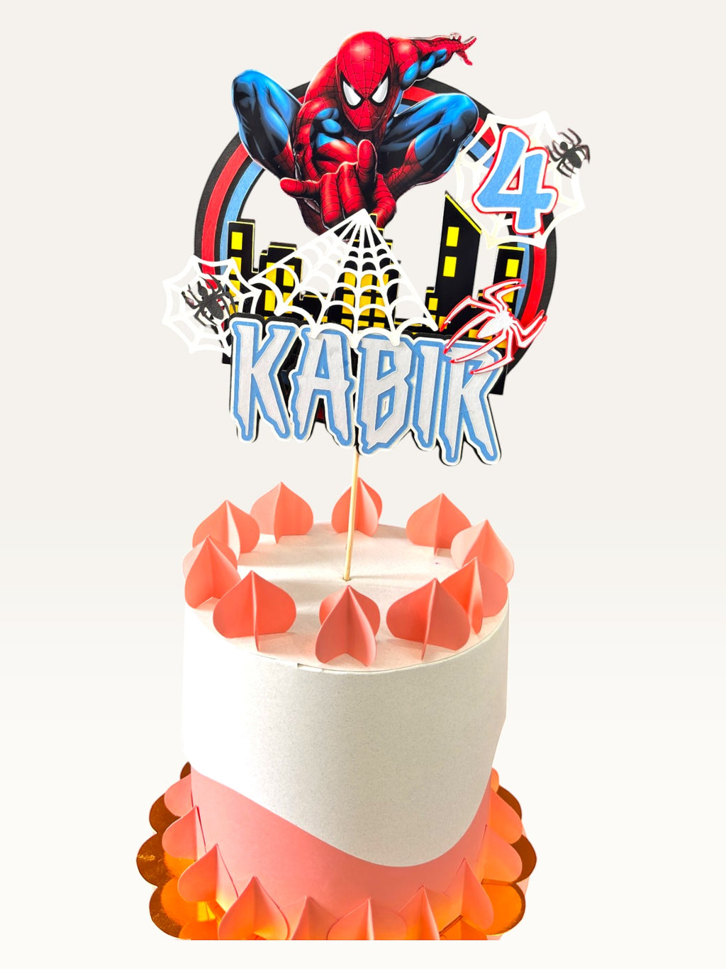 Paper Party Studio personalised Spider Web Hero cake topper with 3D comic skyline, name, and age on a white cake.