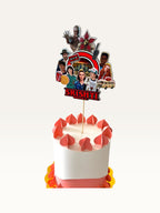 Paper Party Studio personalised Stranger Things themed cake topper featuring character cutouts on a white cake