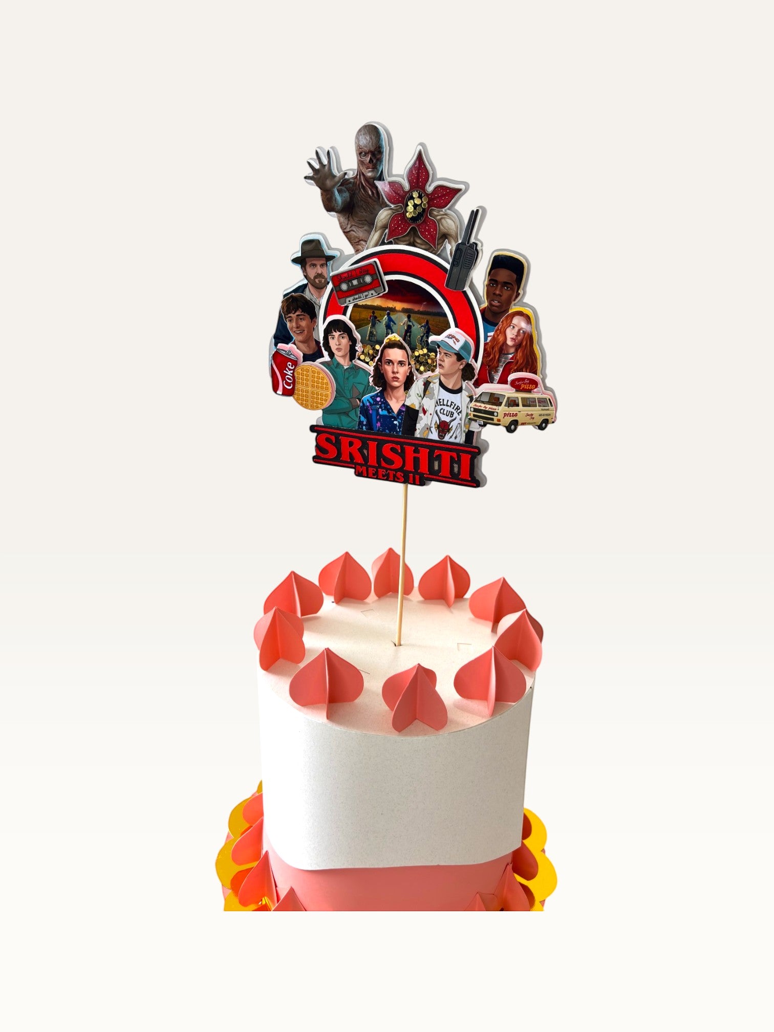 Paper Party Studio personalised Stranger Things themed cake topper featuring character cutouts on a white cake