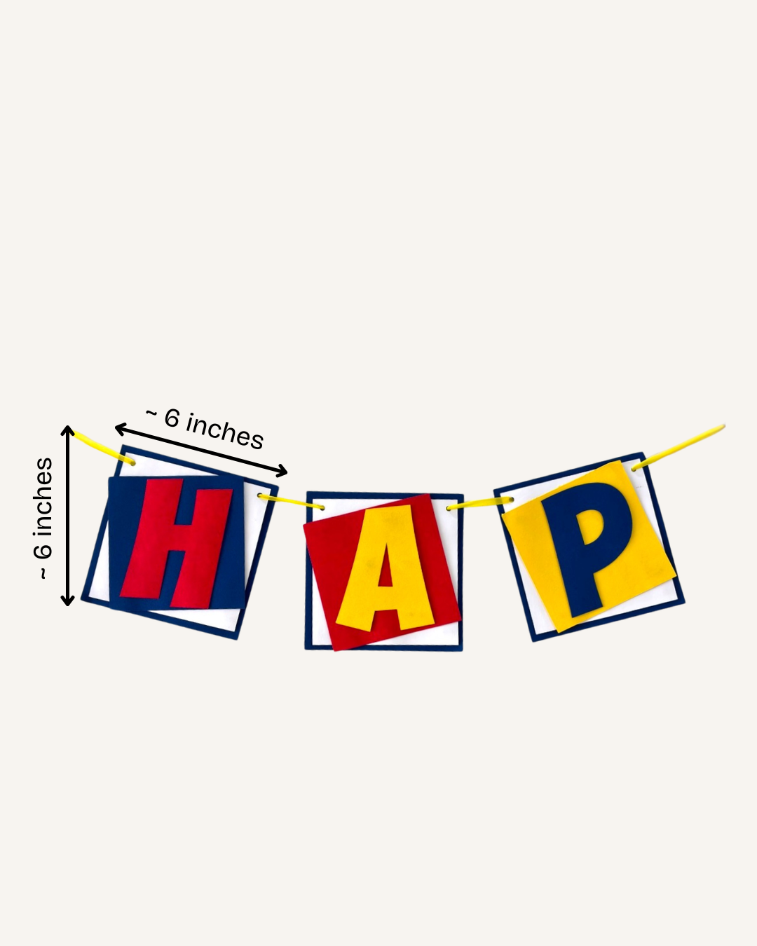 Paper Party Studio superhero birthday banner featuring layered red, yellow, and navy blue paper flags on a string.