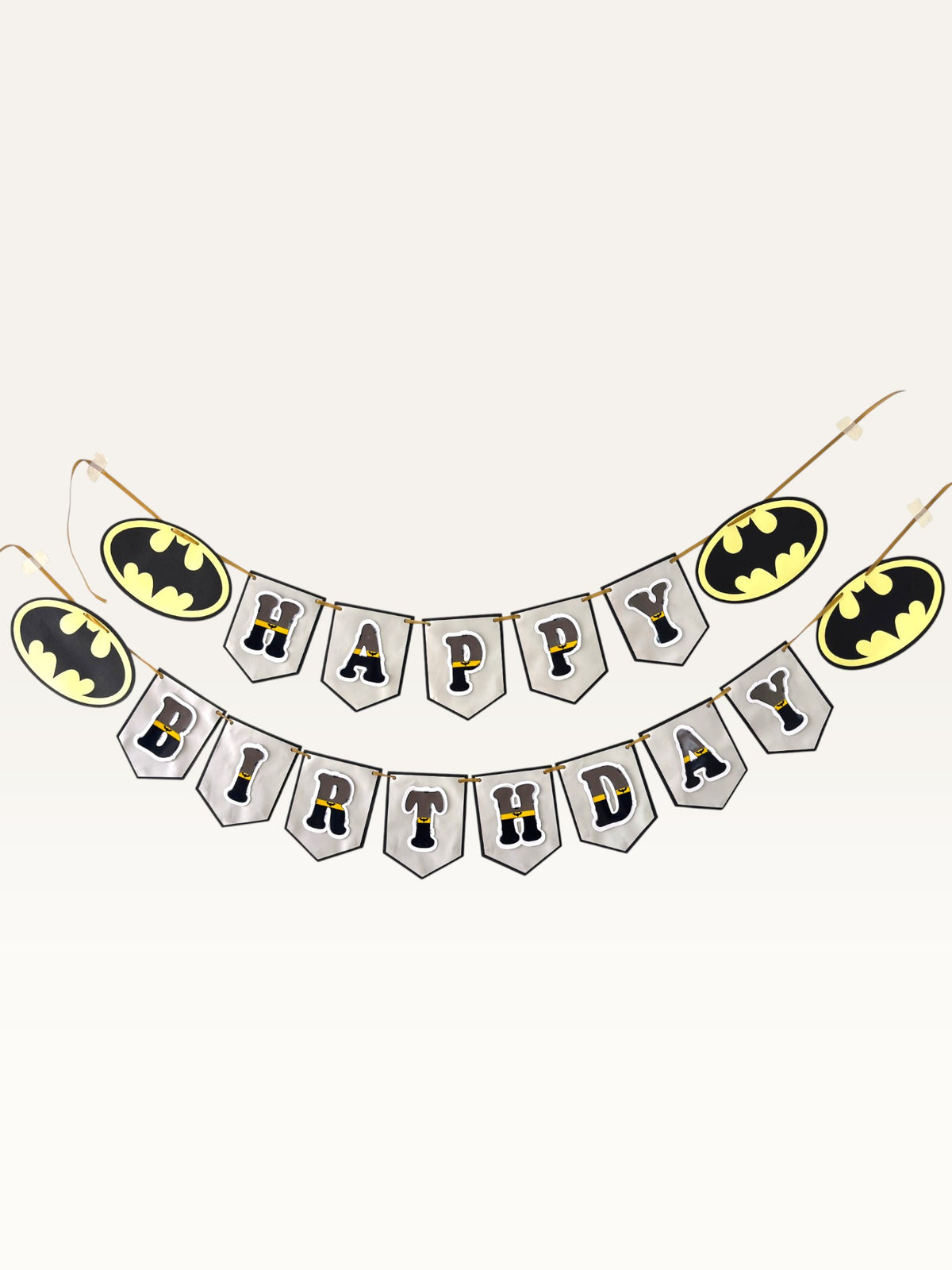 Paper Party Studio superhero themed Happy Birthday banner with charcoal and gold letters on silver pennant flags.