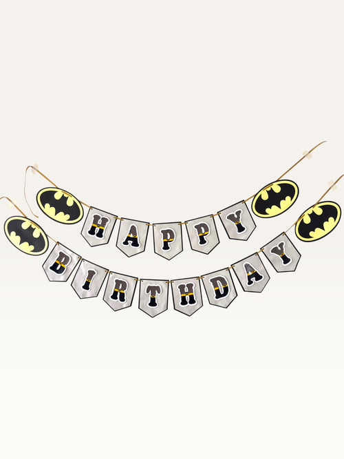 Paper Party Studio superhero themed Happy Birthday banner with charcoal and gold letters on silver pennant flags.