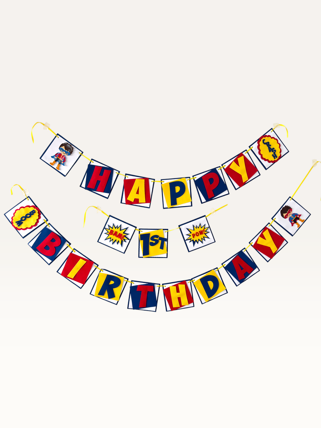 Paper Party Studio superhero birthday banner with red, blue, and yellow comic burst flags and masked hero characters.