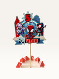 Paper Party Studio personalised superhero cake topper with comic city skyline, masked heroes, and age five banner.