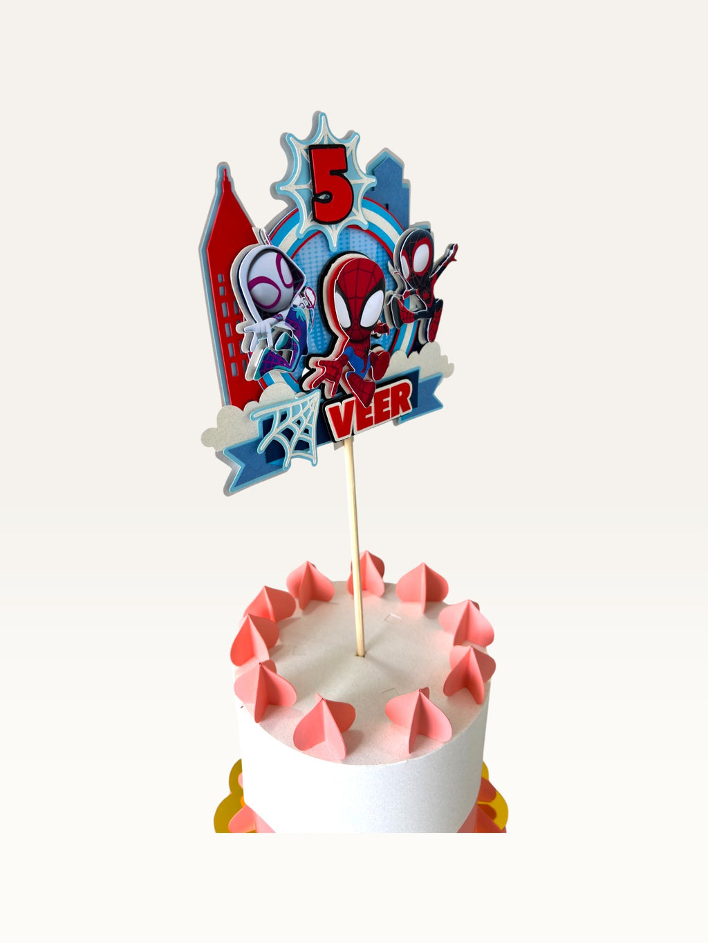 Paper Party Studio personalised superhero cake topper with comic city skyline, masked heroes, and age five on a cake.