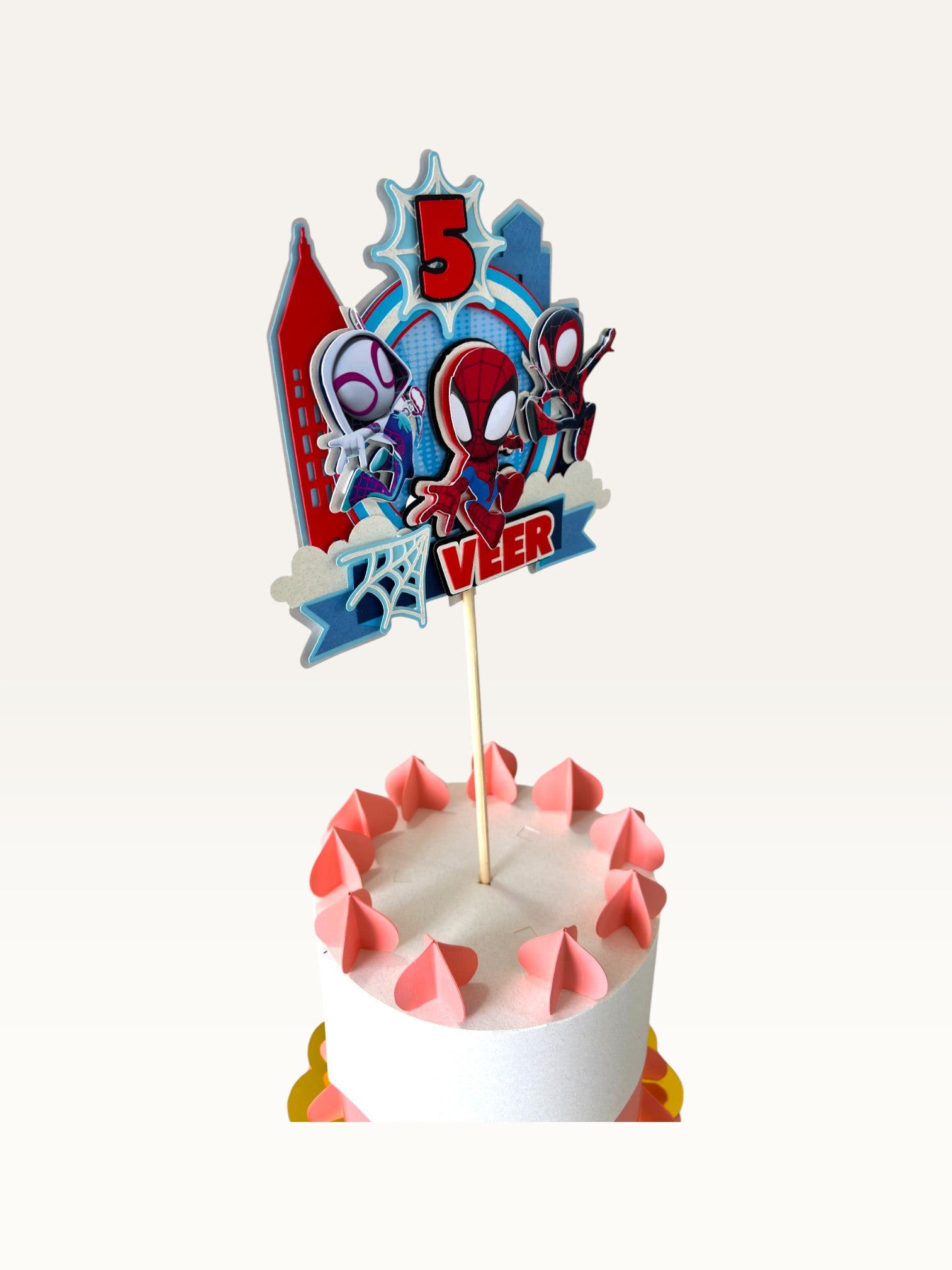 Paper Party Studio personalised superhero cake topper with comic city skyline, masked heroes, and age five on a cake.