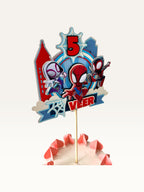 Paper Party Studio personalised superhero cake topper with comic city skyline, masked heroes, and age 5 banner.