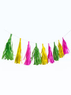 Paper Party Studio handmade tissue paper tassel garland in vibrant pink, yellow, and green for party decorations.