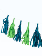 Paper Party Studio handmade tissue paper tassel garland in alternating teal and lime green for party decor.