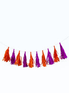 Paper Party Studio handmade orange and purple tissue paper tassel garland for party decorations and photo backdrops.
