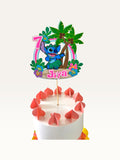 Paper Party Studio personalised tropical luau cake topper featuring a blue alien, palm trees, and hibiscus flowers.