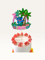 Paper Party Studio personalised tropical luau cake topper featuring a blue alien, palm trees, and hibiscus flowers.