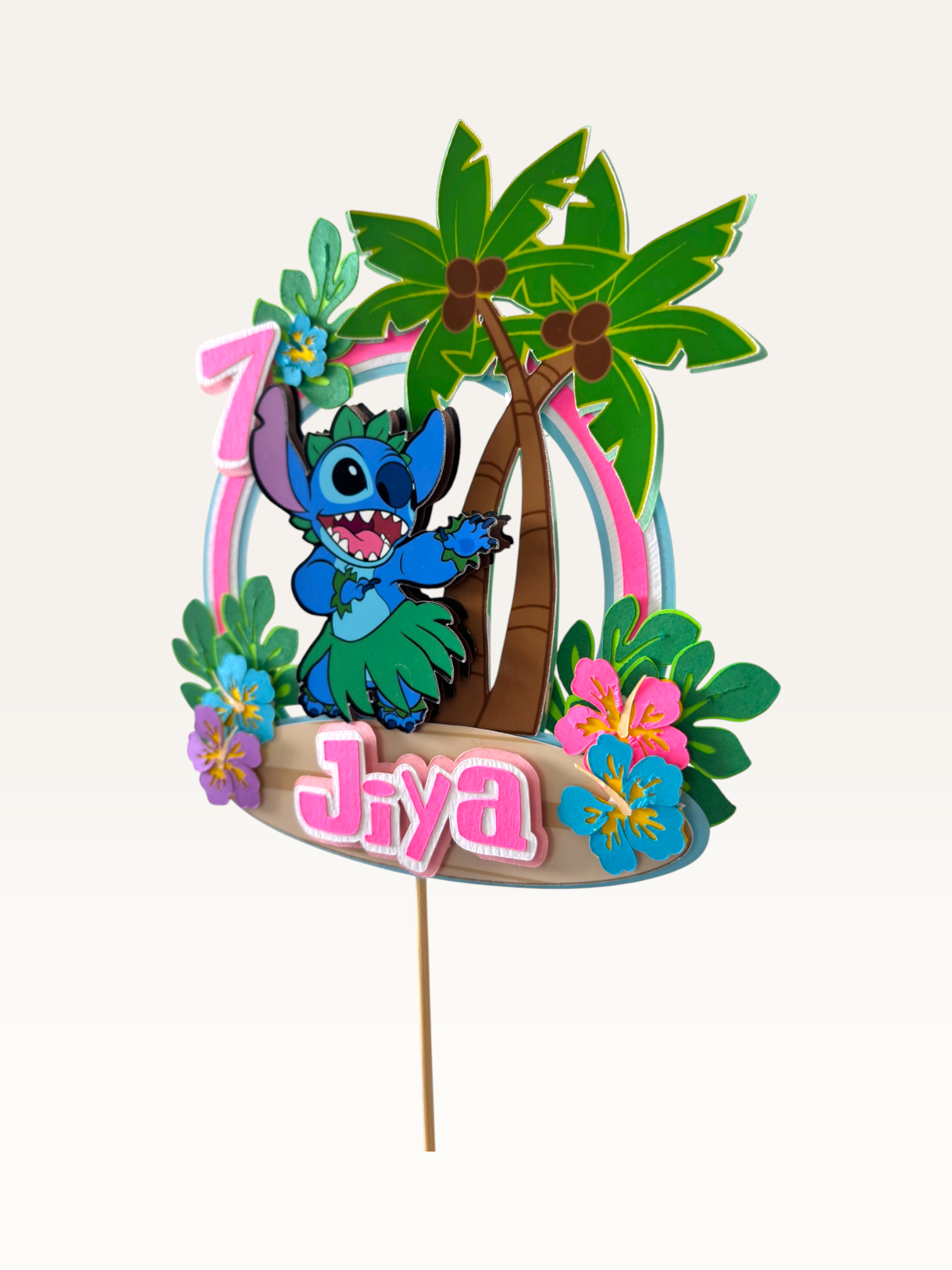 Paper Party Studio tropical luau cake topper with blue alien in hula skirt and flowers