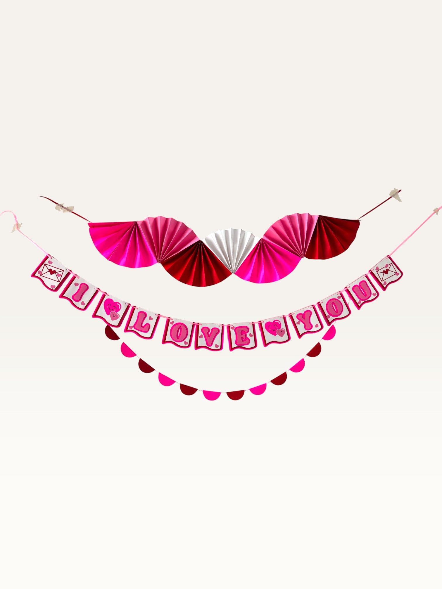Paper Party Studio Valentine's decoration set featuring a pink, red, and white fan, I Love You banner, and garland.