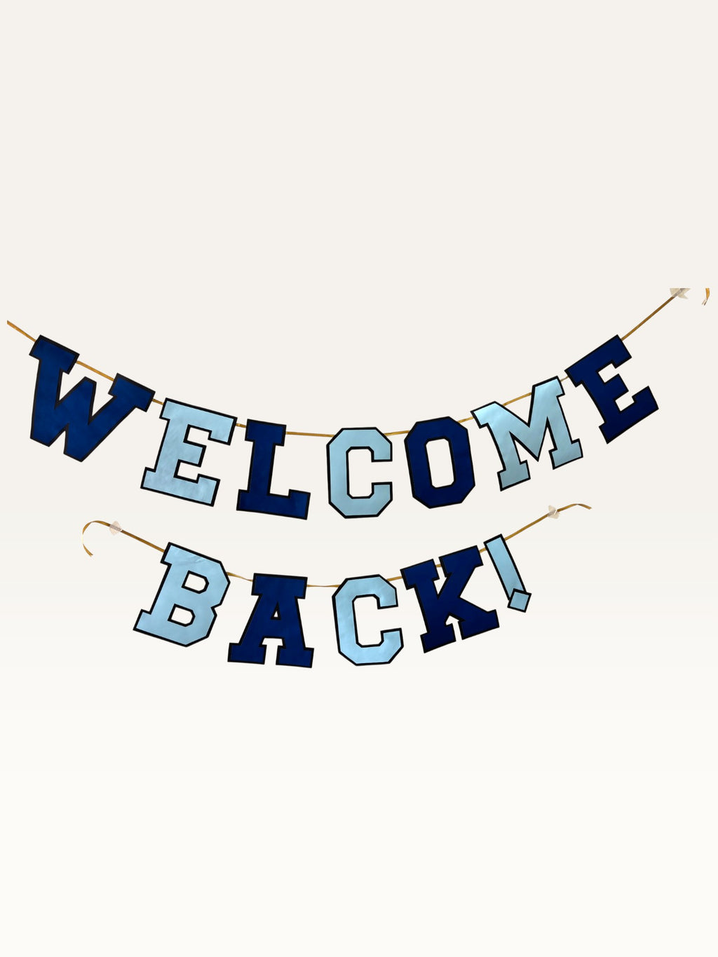 Paper Party Studio Welcome Back banner featuring navy and sky blue varsity letters strung on a gold cord.