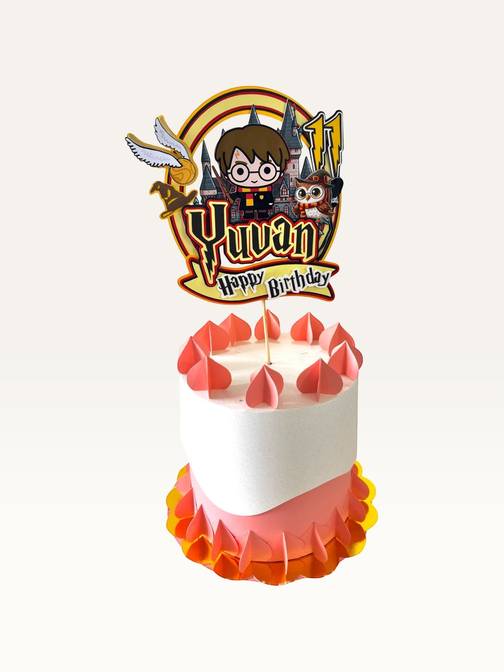Paper Party Studio personalised wizard school cake topper with a young wizard, owl, and castle on a birthday cake.
