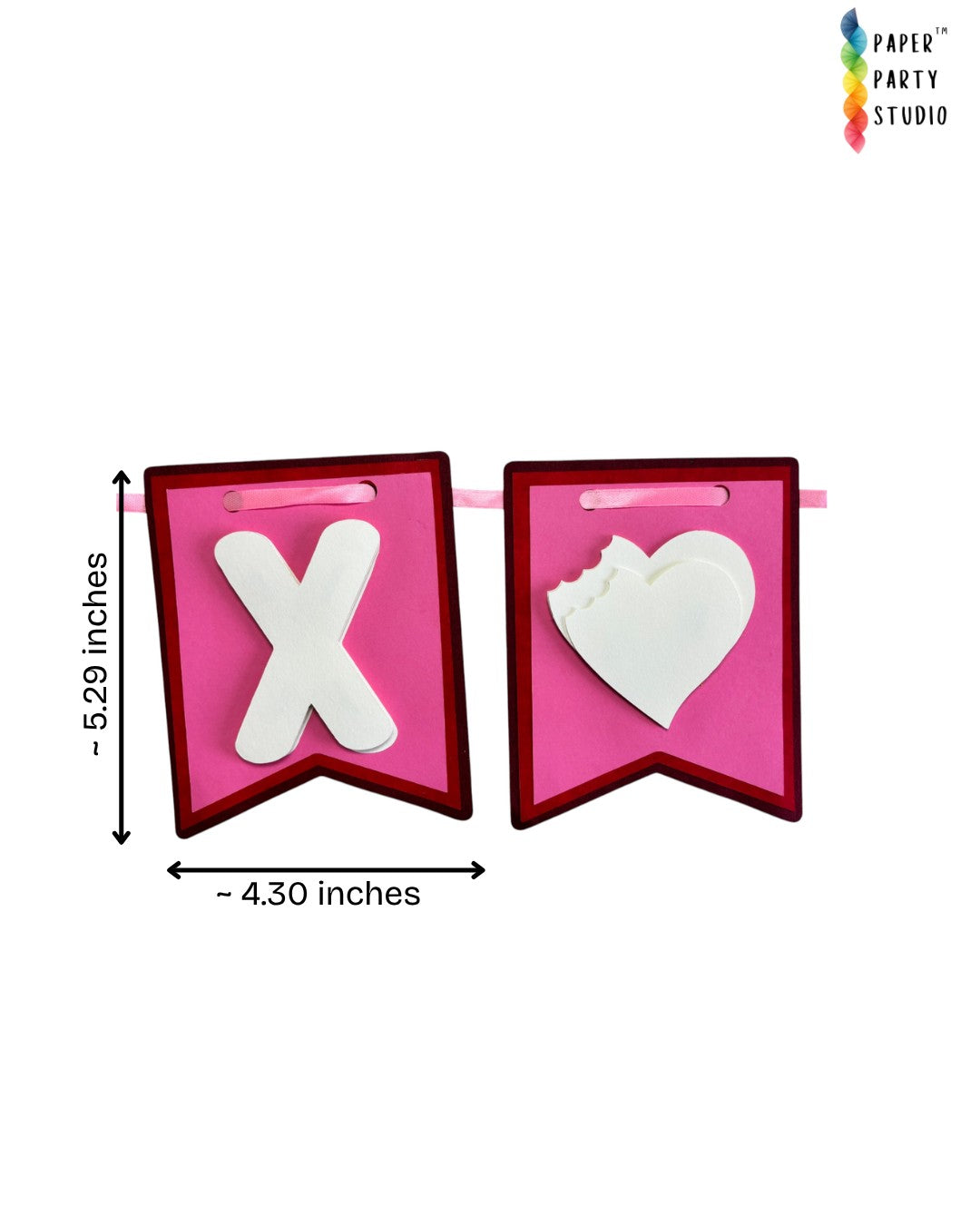 Paper Party Studio XOXO Valentine's bunting with pink and red cardstock flags, white heart cutouts, and satin ribbon.